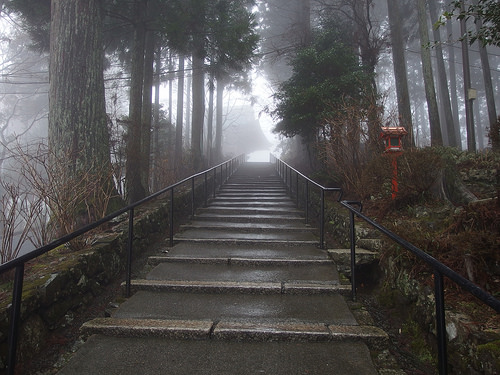 stairs walking up a mountain, symbolizing success or hard work