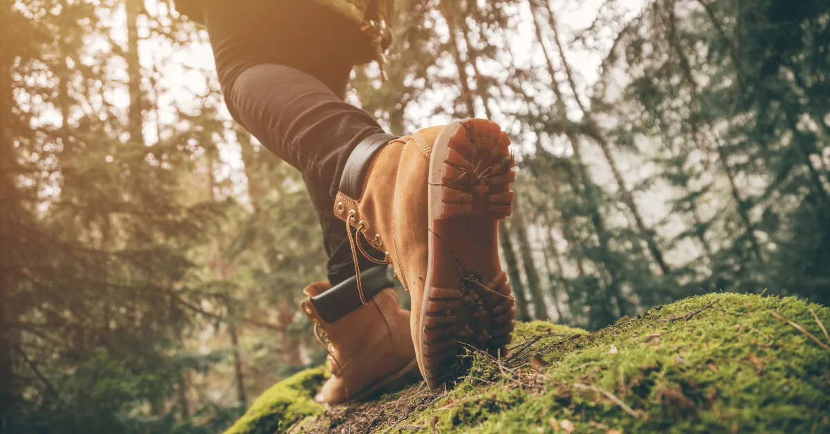 woman hiking in the forest for exercise and to get in shape